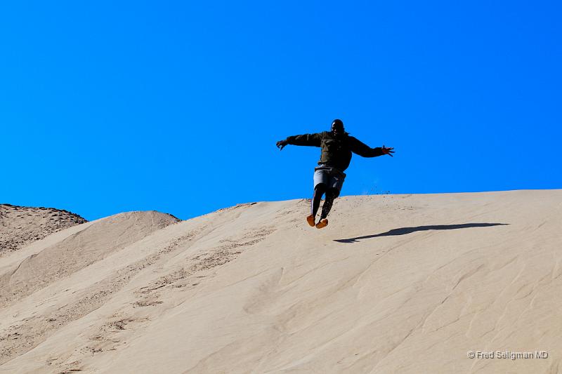 20090605_101854 D300 X1.jpg - Our guide is 'jumping' off a dune!